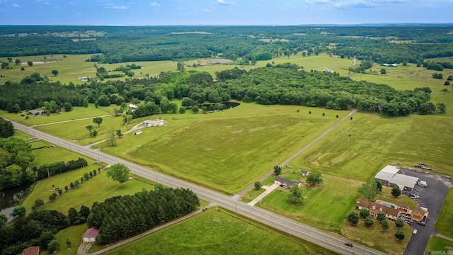 birds eye view of property with a rural view