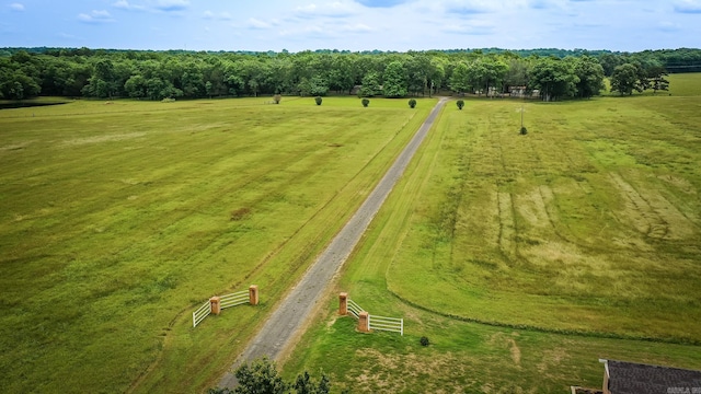 birds eye view of property with a rural view