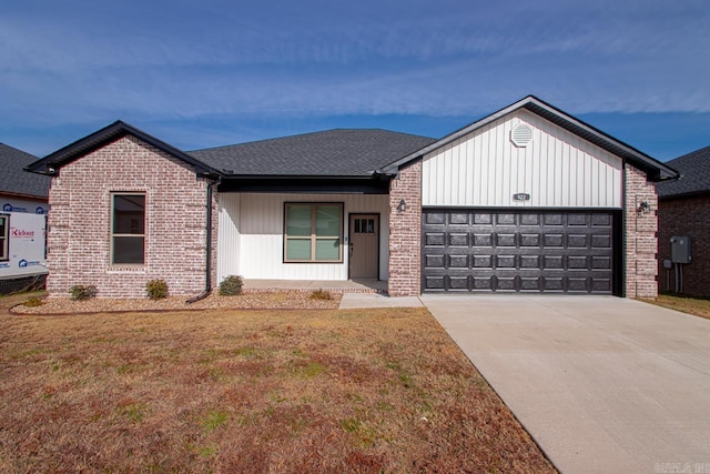 view of front of house with a garage and a front yard