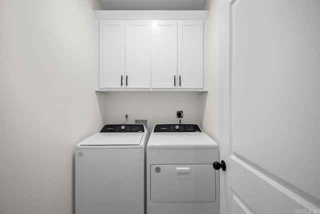 laundry room featuring cabinets and independent washer and dryer