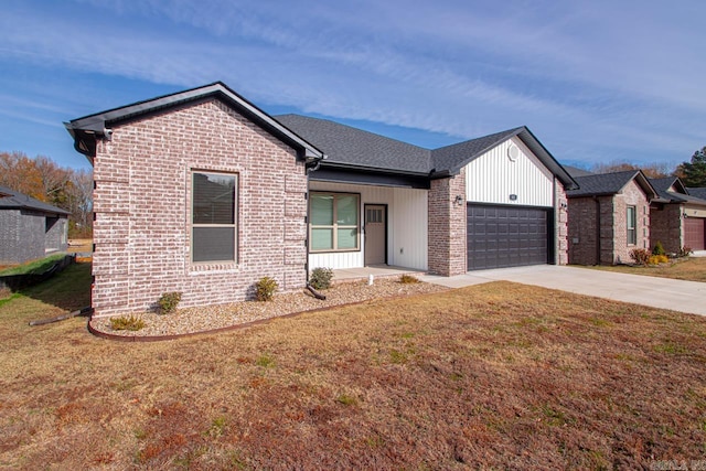 view of front of house with a garage and a front lawn