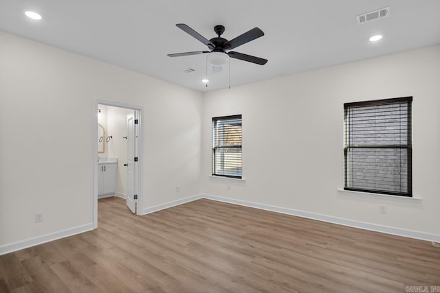 unfurnished room featuring ceiling fan and light hardwood / wood-style flooring