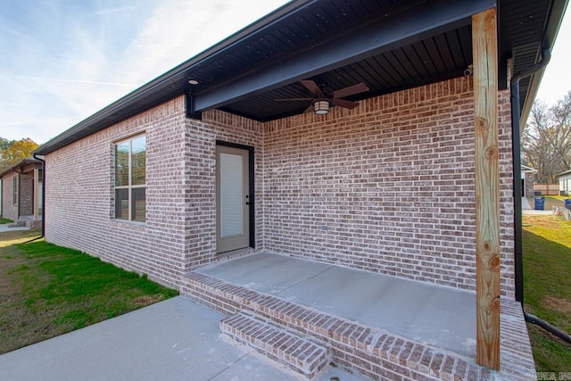 doorway to property featuring ceiling fan