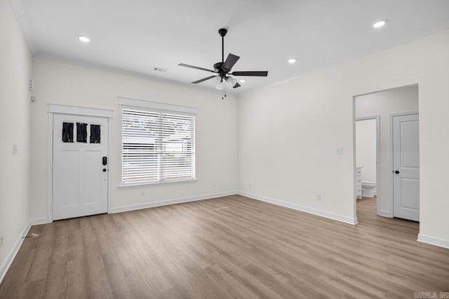 interior space with ceiling fan and light hardwood / wood-style flooring