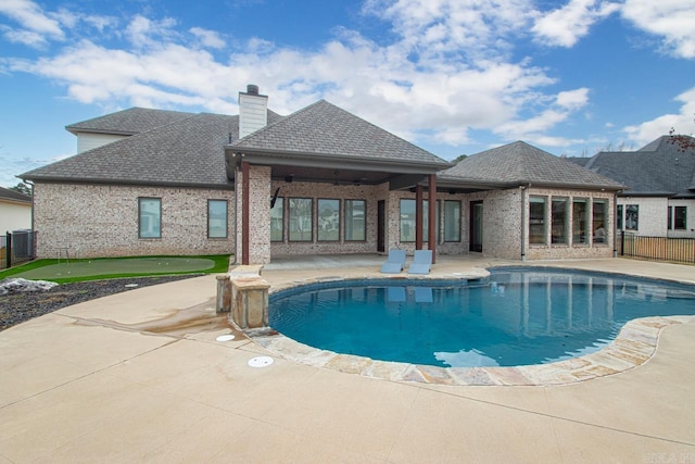 view of swimming pool featuring a patio area and central air condition unit