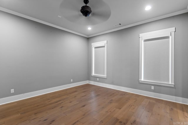 unfurnished room with wood-type flooring, ceiling fan, and crown molding