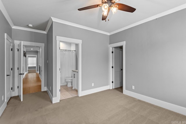 unfurnished bedroom with ensuite bathroom, ceiling fan, light colored carpet, and ornamental molding