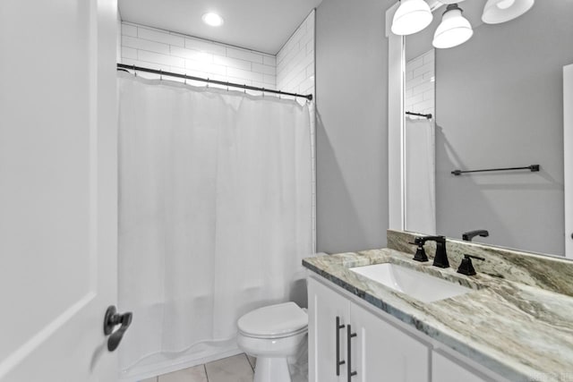 full bathroom featuring tile patterned floors, vanity, toilet, and shower / tub combo with curtain