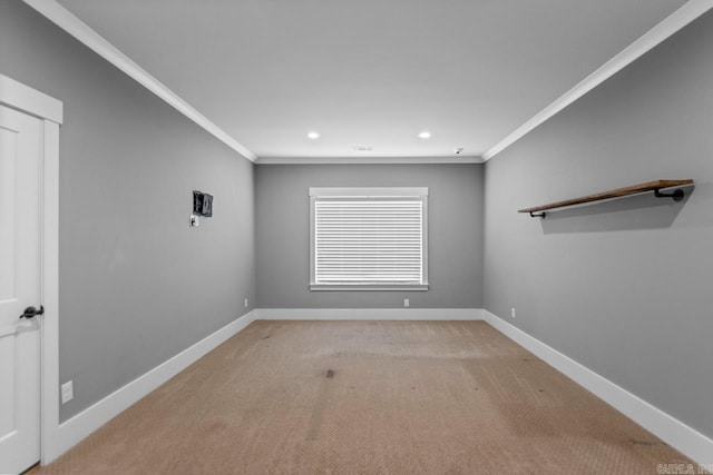 carpeted empty room featuring ornamental molding