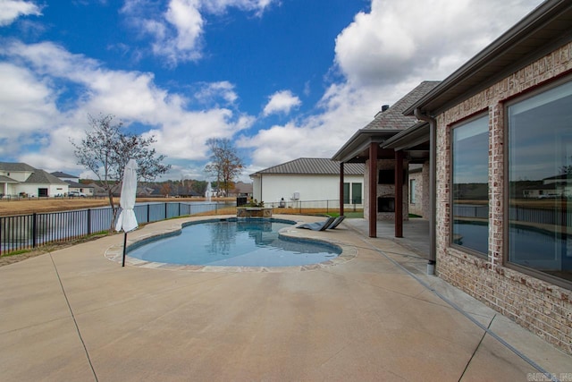 view of pool featuring a patio area and a water view