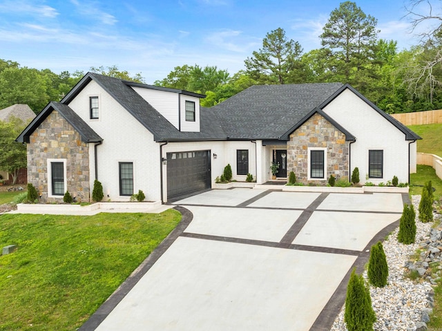 modern farmhouse style home featuring a front yard and a garage