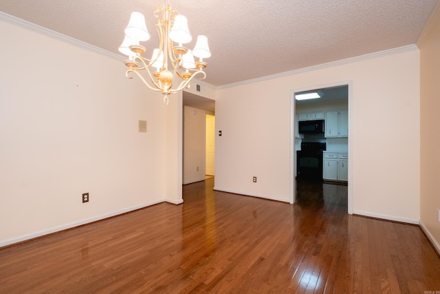 unfurnished room featuring a notable chandelier, dark hardwood / wood-style floors, and a textured ceiling