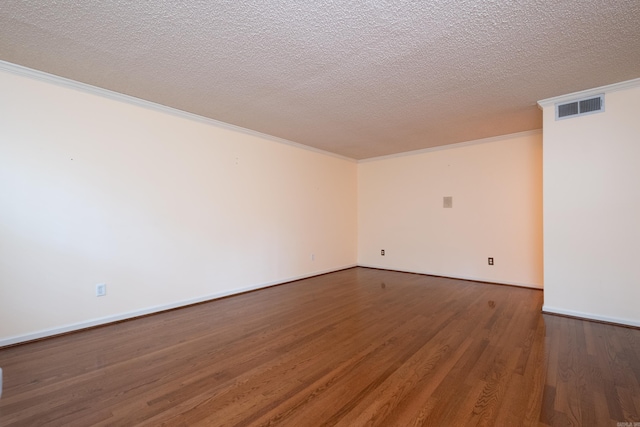 unfurnished room with hardwood / wood-style flooring, crown molding, and a textured ceiling