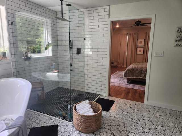 bathroom with a textured ceiling, ceiling fan, wood-type flooring, and walk in shower