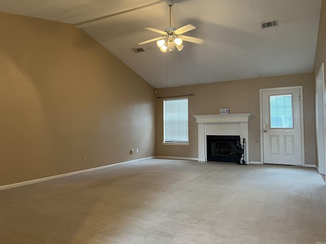 unfurnished living room with ceiling fan, high vaulted ceiling, and light colored carpet