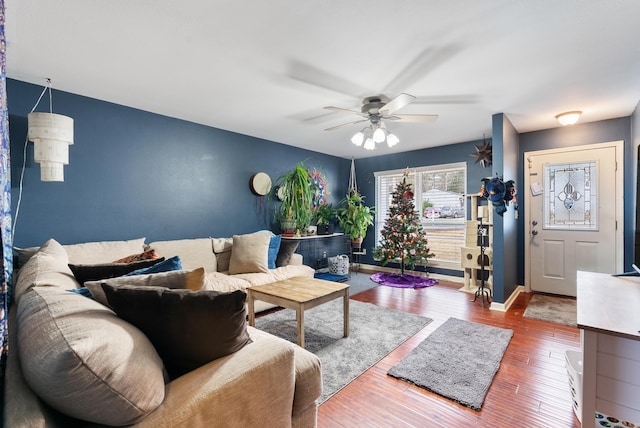 living room with hardwood / wood-style flooring and ceiling fan