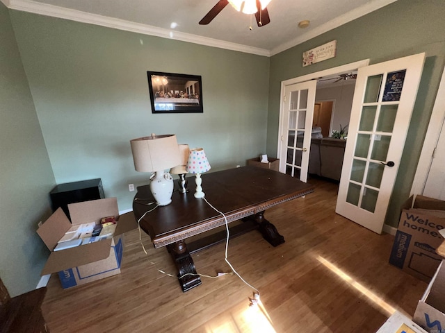 home office featuring hardwood / wood-style flooring, ceiling fan, crown molding, and french doors