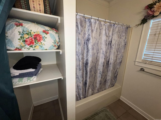 bathroom featuring tile patterned flooring and shower / bath combination with curtain