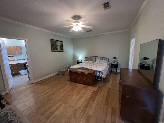 bedroom with ceiling fan, ornamental molding, and light wood-type flooring