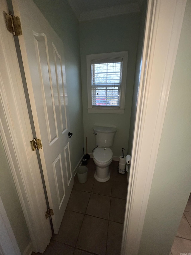 bathroom featuring tile patterned flooring and toilet