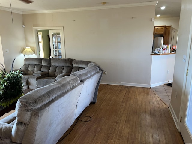 living room with crown molding, hardwood / wood-style floors, and ceiling fan