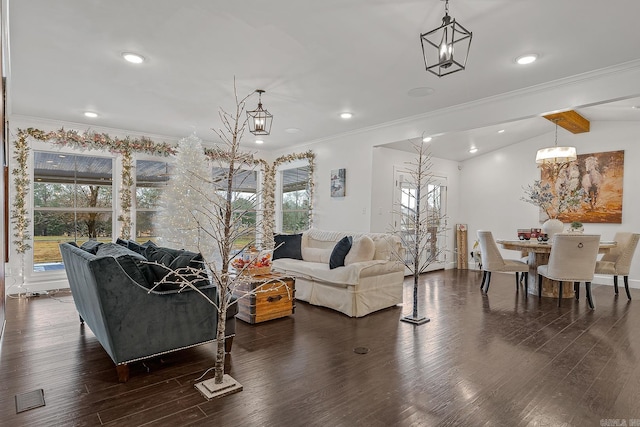 living room featuring ornamental molding, lofted ceiling with beams, and dark wood-type flooring