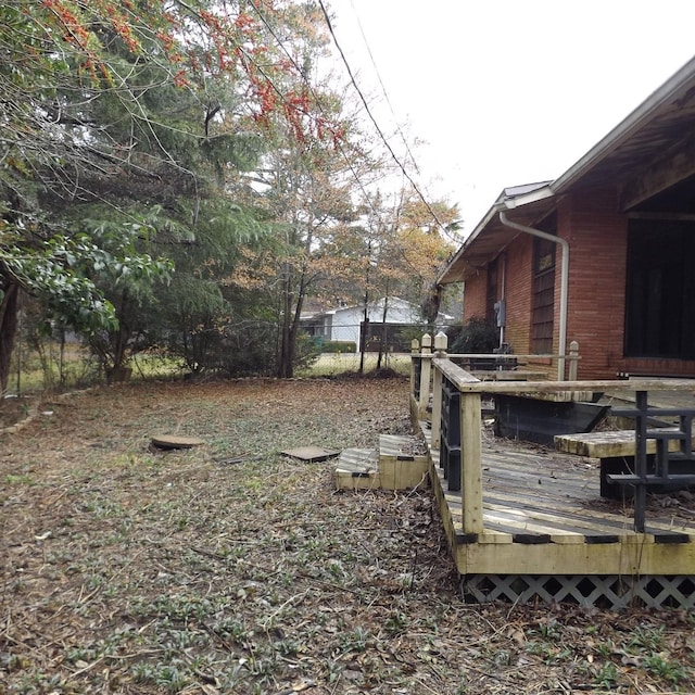 view of yard featuring a deck