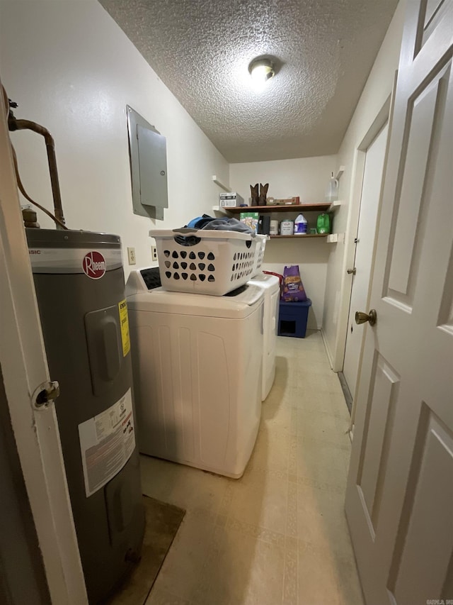 washroom with separate washer and dryer, electric water heater, electric panel, and a textured ceiling