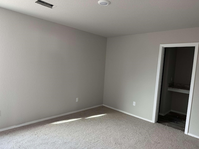 unfurnished bedroom featuring carpet flooring