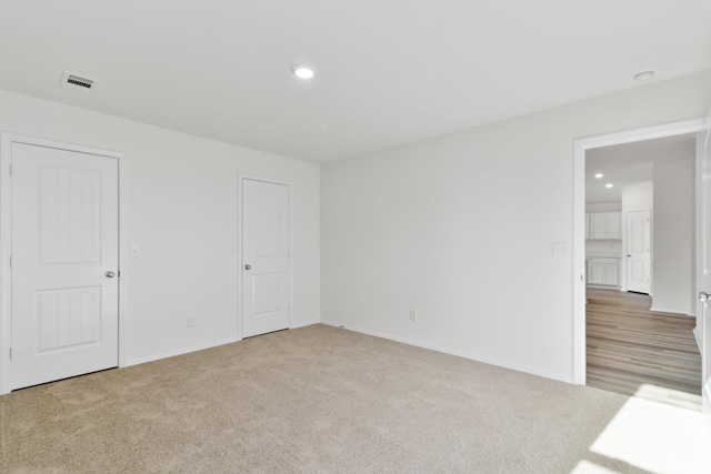 unfurnished room featuring carpet flooring