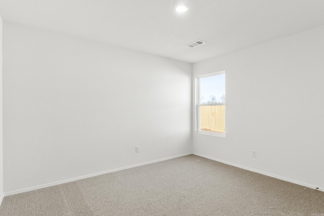 spare room featuring carpet flooring