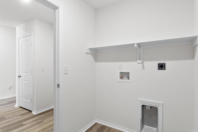 clothes washing area with light hardwood / wood-style floors, electric dryer hookup, and hookup for a washing machine