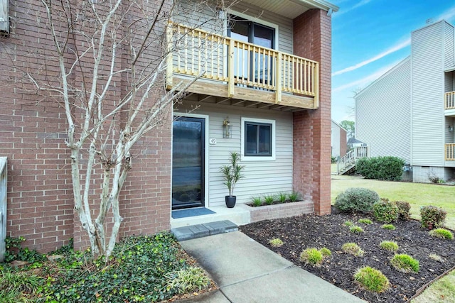 doorway to property featuring a balcony