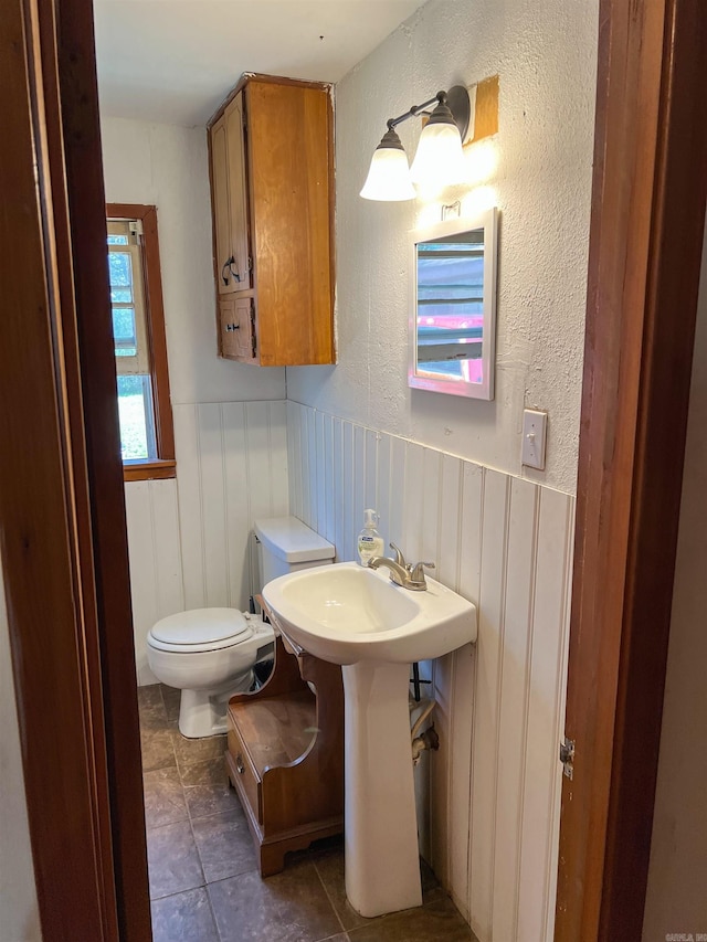 bathroom featuring tile patterned floors and toilet