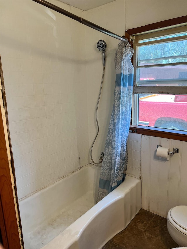 bathroom featuring tile patterned flooring and toilet