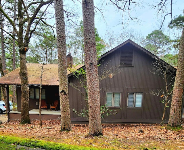 back of property featuring a porch