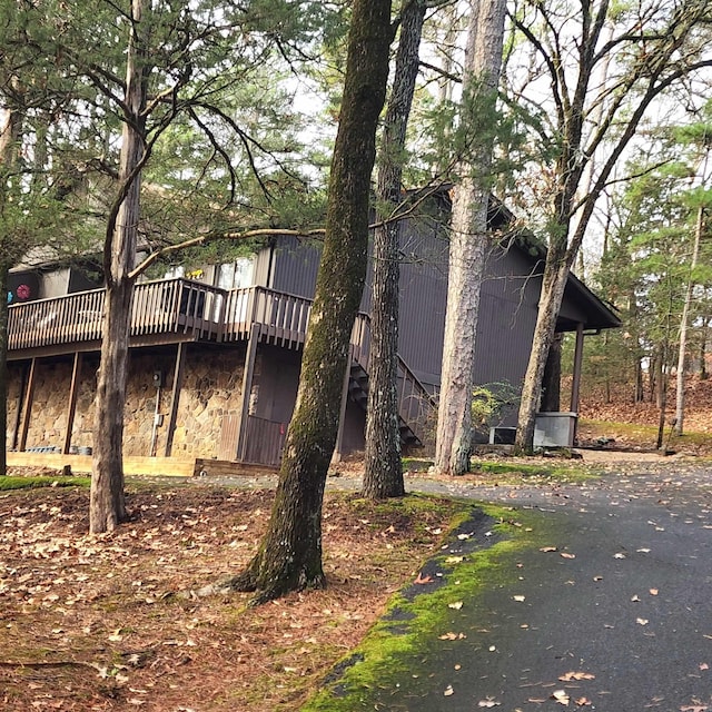 back of property featuring a deck