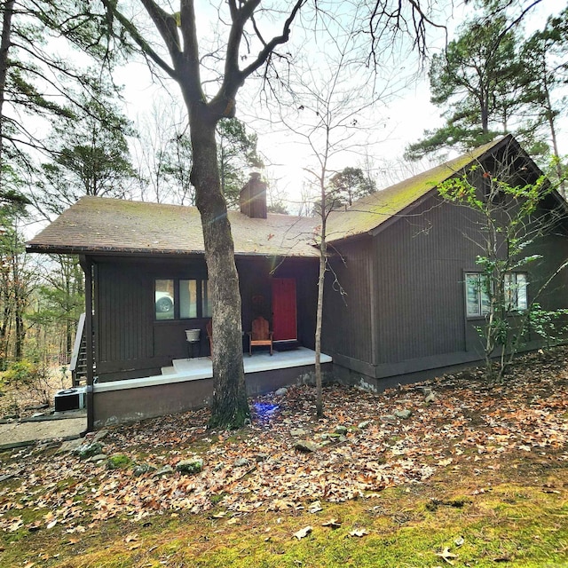 view of property exterior featuring a porch