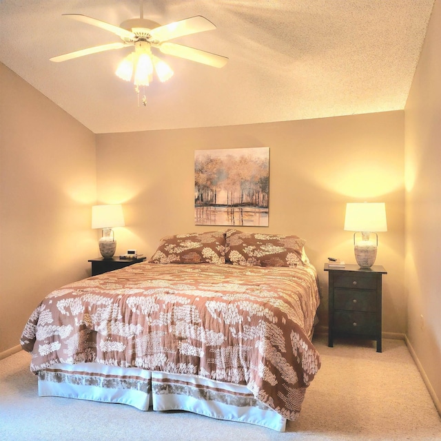 carpeted bedroom with ceiling fan, a textured ceiling, and vaulted ceiling