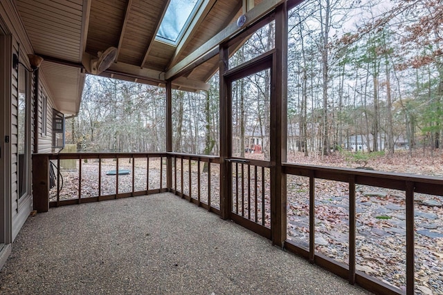 unfurnished sunroom featuring wooden ceiling and vaulted ceiling