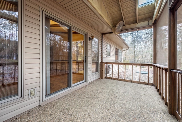 unfurnished sunroom featuring wooden ceiling