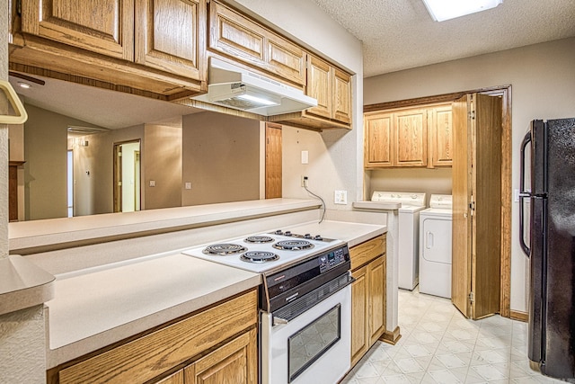 kitchen with black refrigerator, white electric stove, a textured ceiling, extractor fan, and washing machine and clothes dryer