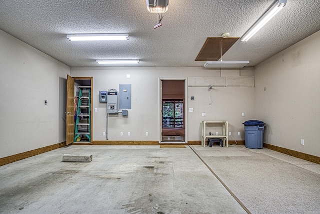 garage featuring a garage door opener and electric panel