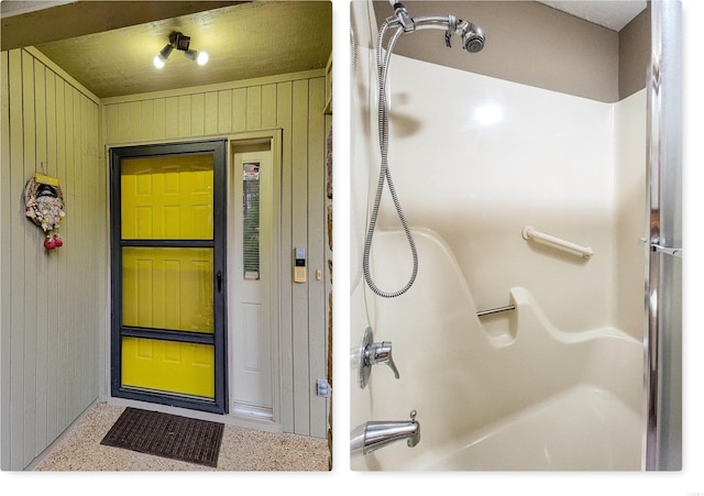 bathroom featuring wooden walls