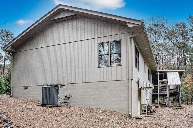 view of side of property featuring central AC unit