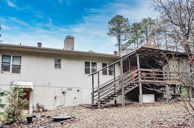 back of house with a sunroom