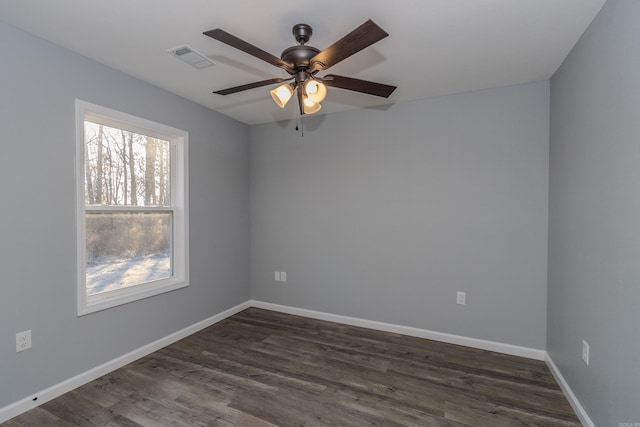 unfurnished room with ceiling fan and dark wood-type flooring