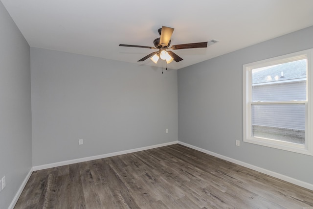 empty room featuring hardwood / wood-style flooring and ceiling fan