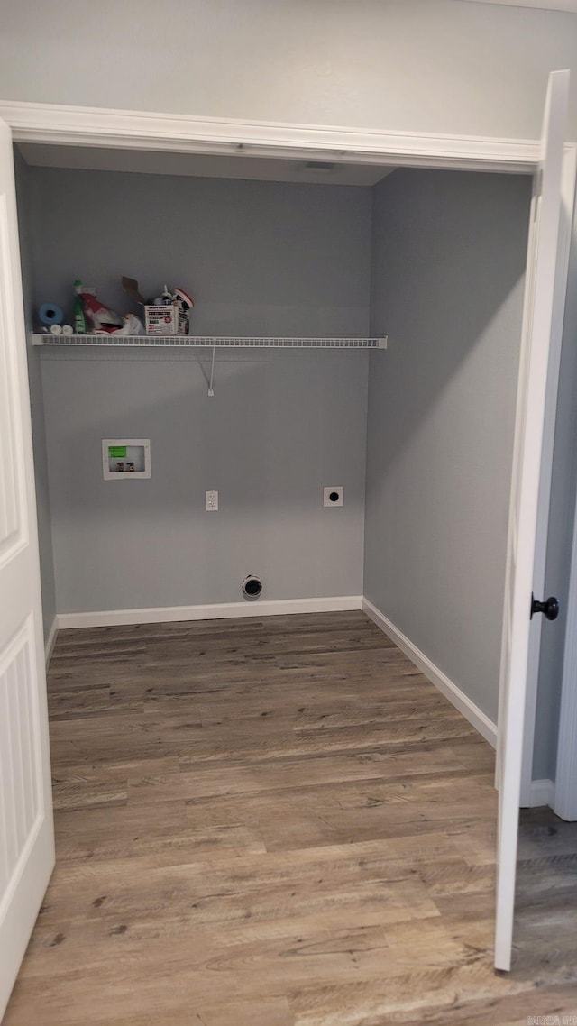 laundry room with hardwood / wood-style flooring, electric dryer hookup, and hookup for a washing machine