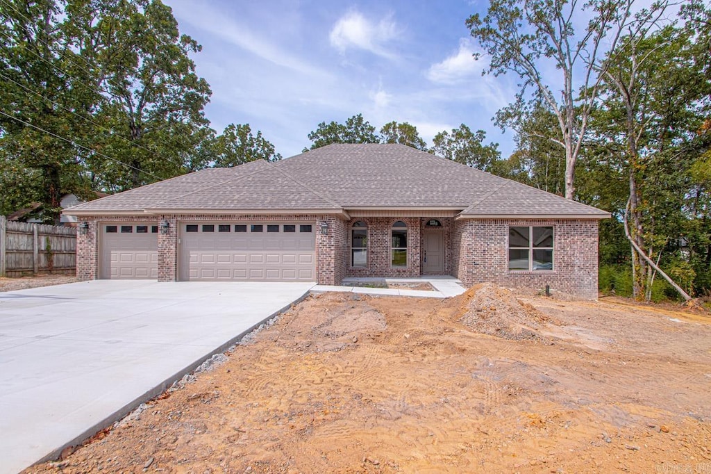 ranch-style home with a garage